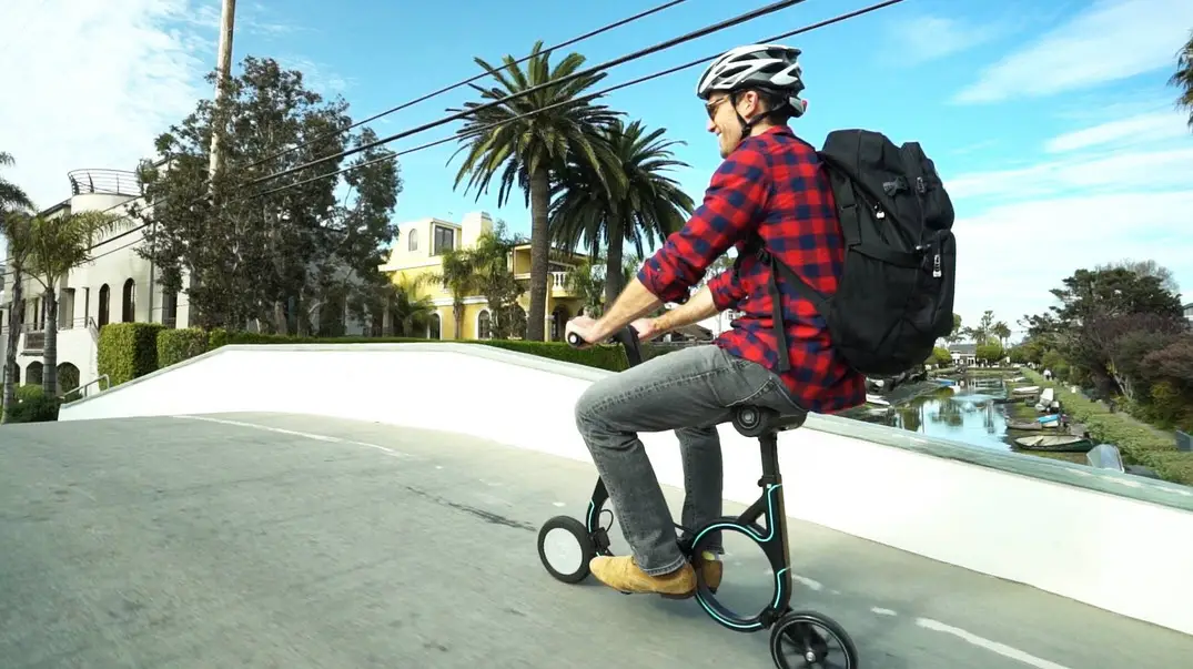man riding the smacircle s1 on the road
